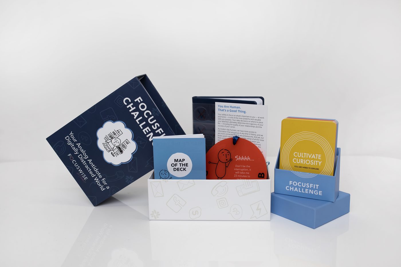 The complete FocusFit Challenge set — box, card decks, and guidebook